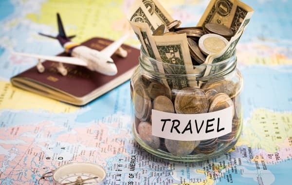 Travel budget concept with compass, passport and aircraft toy